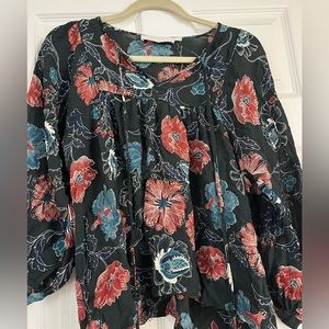 Teal blouse with multicolored floral print in size medium.